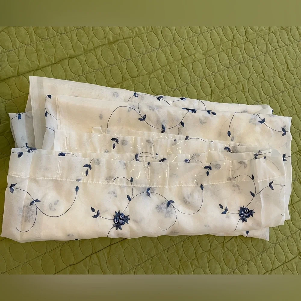 White Sheer Shower Curtains with a pattern delicate blue flowers through out